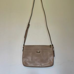 Medium/ small tan Coach purse